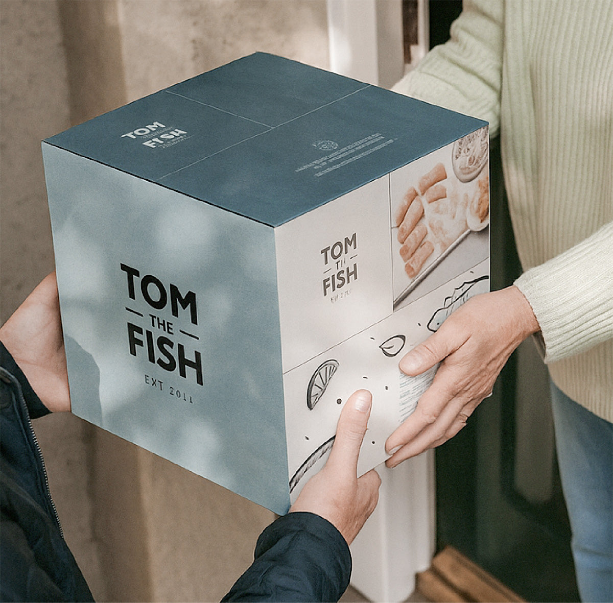 Tom the Fish Fish Box being handed to customer